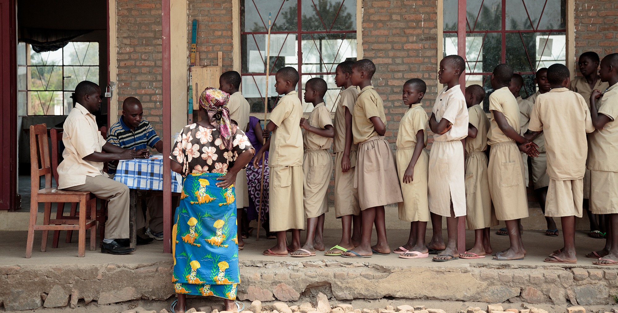Children waiting in line for medicine